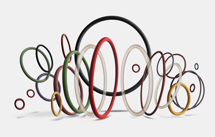 Ampia selezione di O-ring industriali e guarnizioni statiche in diversi materiali e colori su sfondo bianco